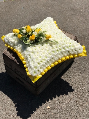 Traditional yellow and white cushion