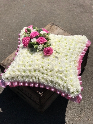 Traditional pink and white cushion