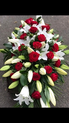 Red rose and white lily casket spray